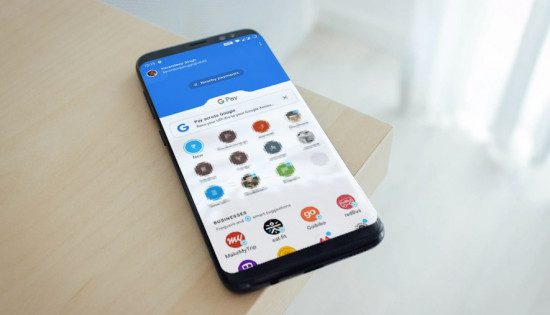 a smartphone with google pay lying on the table